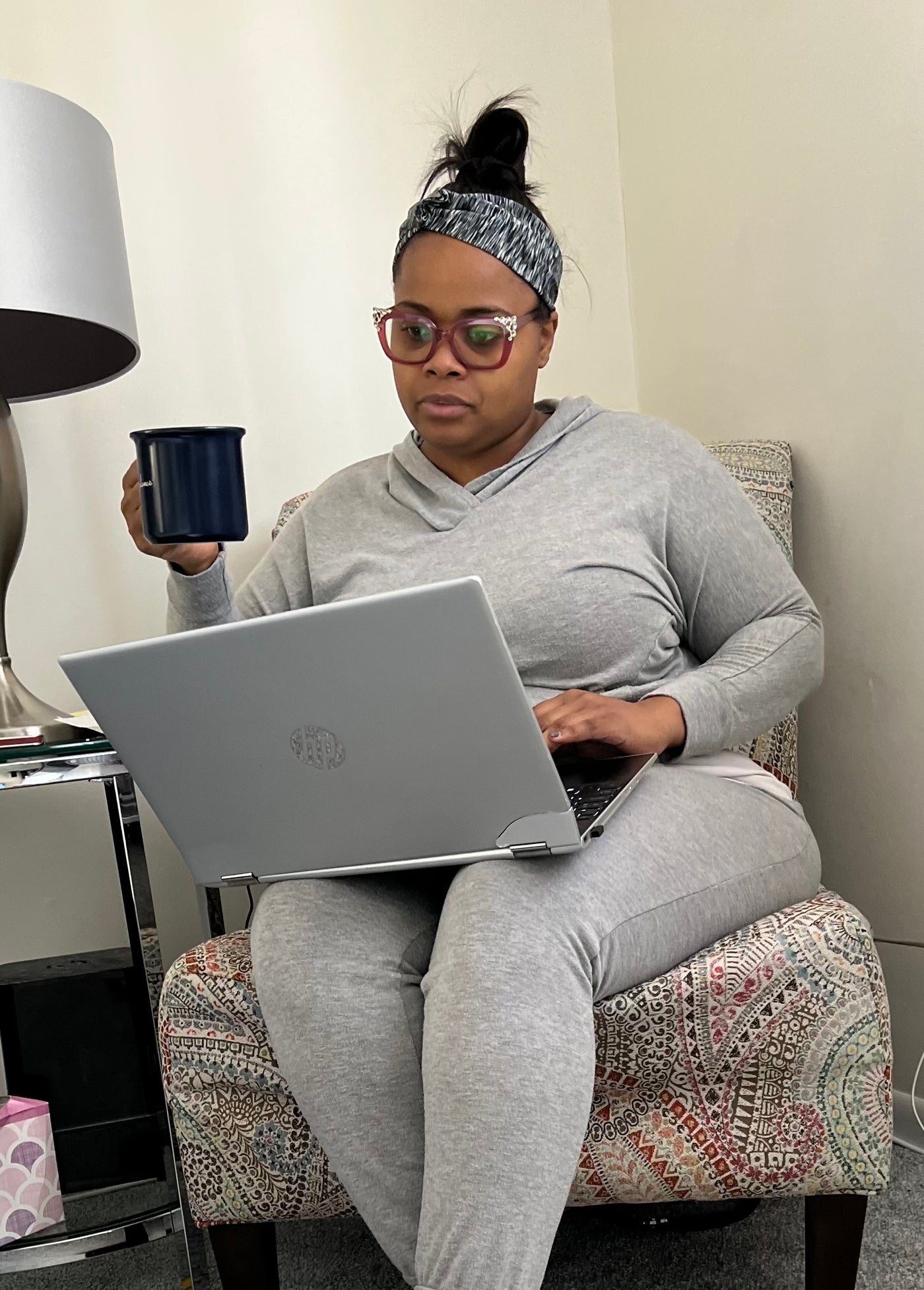 Tekeyah at home with a cup of GT Coffee